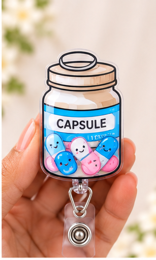 Happy Little Capsule Shaker badge reel