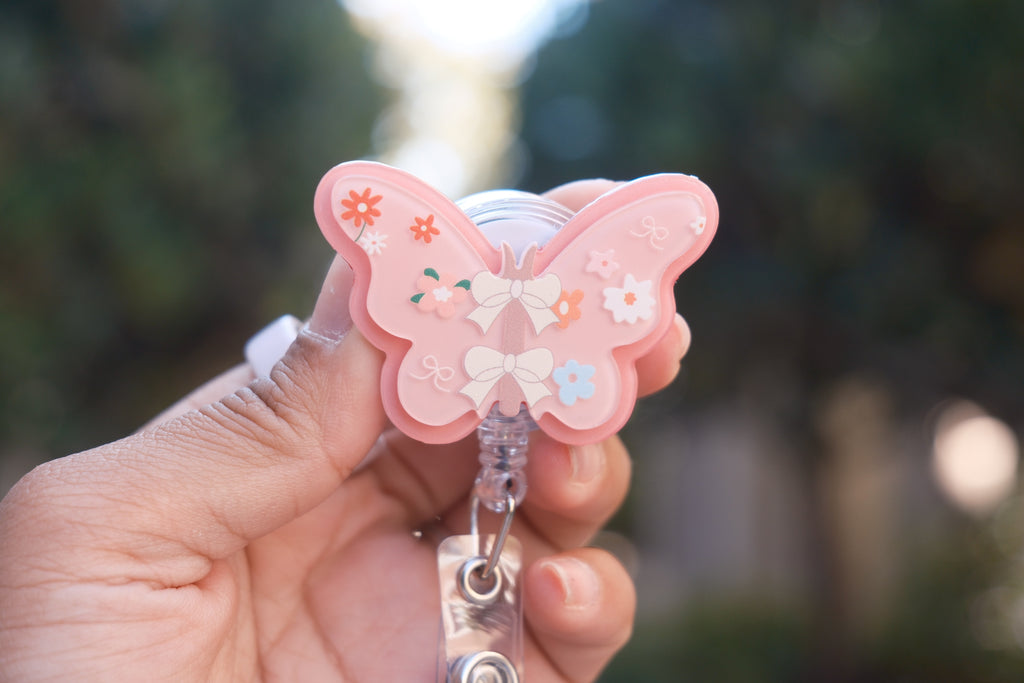 Pink Butterfly with Daisy Badge Reel