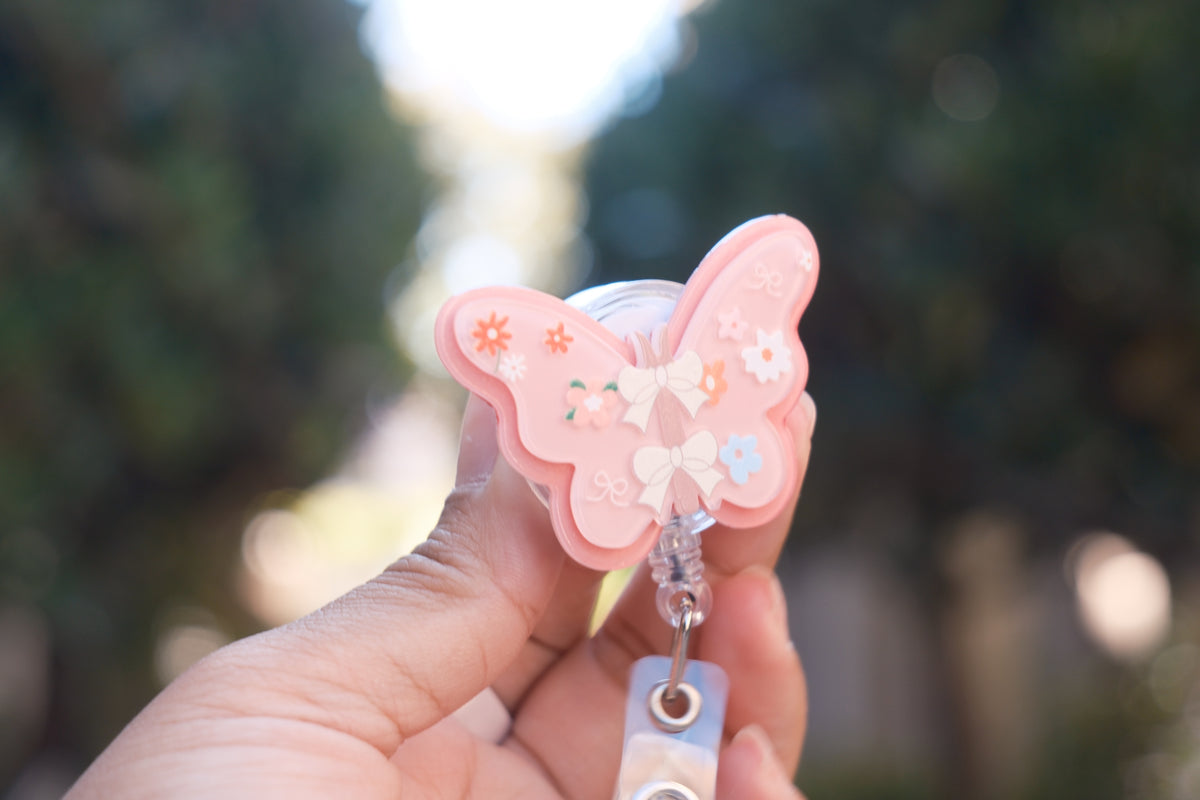 Pink Butterfly with Daisy Badge Reel