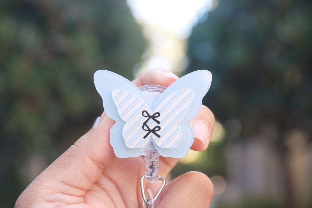 Blue Butterfly with Black Bows Badge Reel