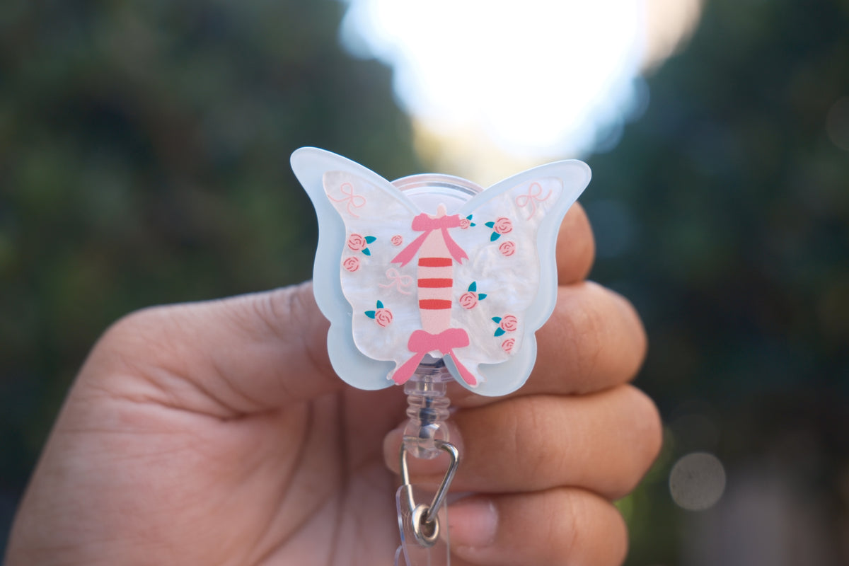Blue Butterfly with Bows and Roses Badge Reel