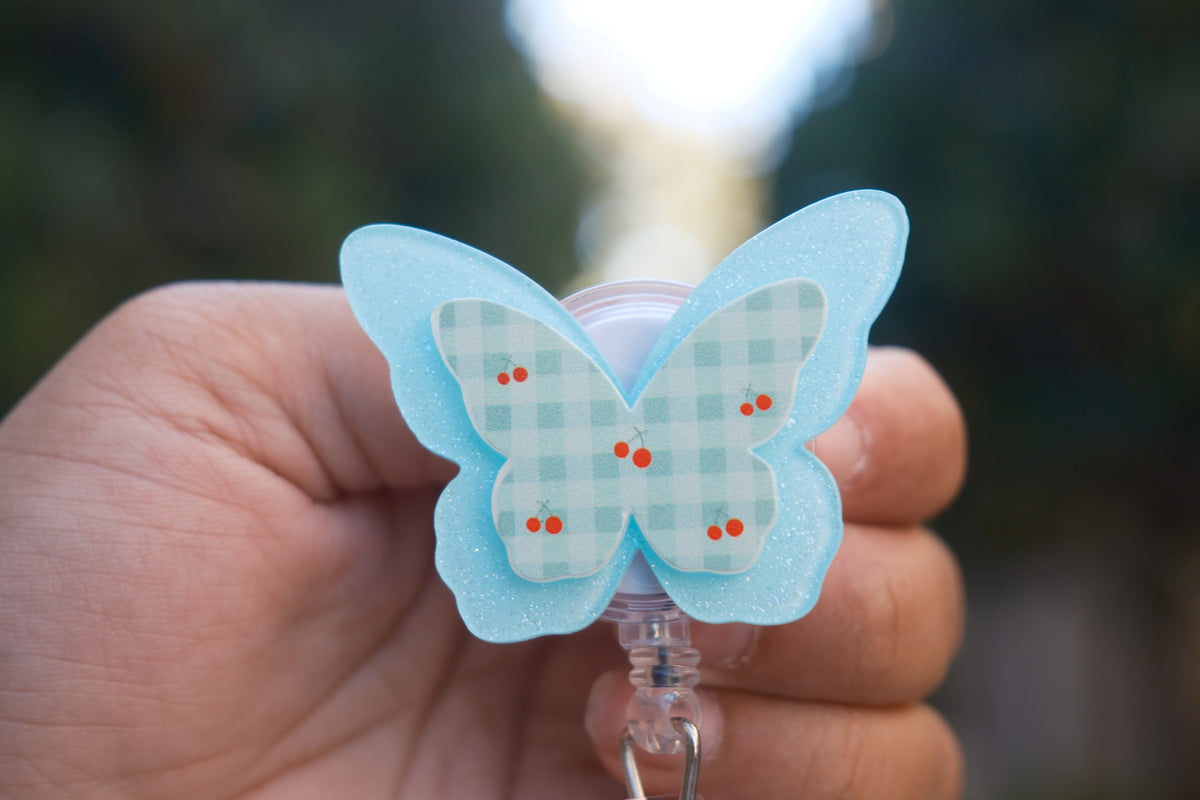 Blue Butterfly with Cherry Badge Reel