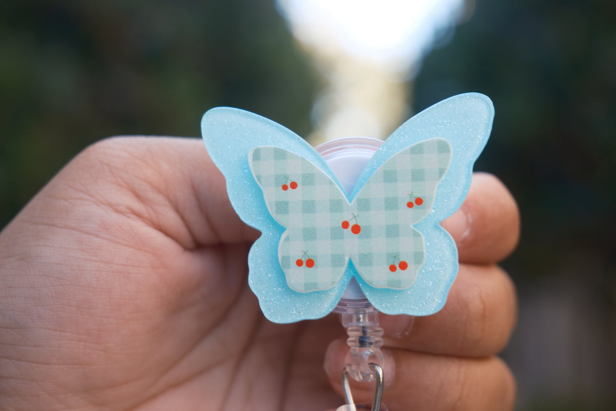 Blue Butterfly with Cherry Badge Reel